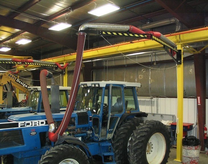 Fume-A-Vent boom arms installed to capture diesel exhaust and emissions from an engine repair shop.