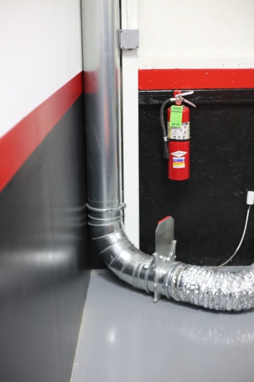 Dyno exhaust hose attached to ductwork.