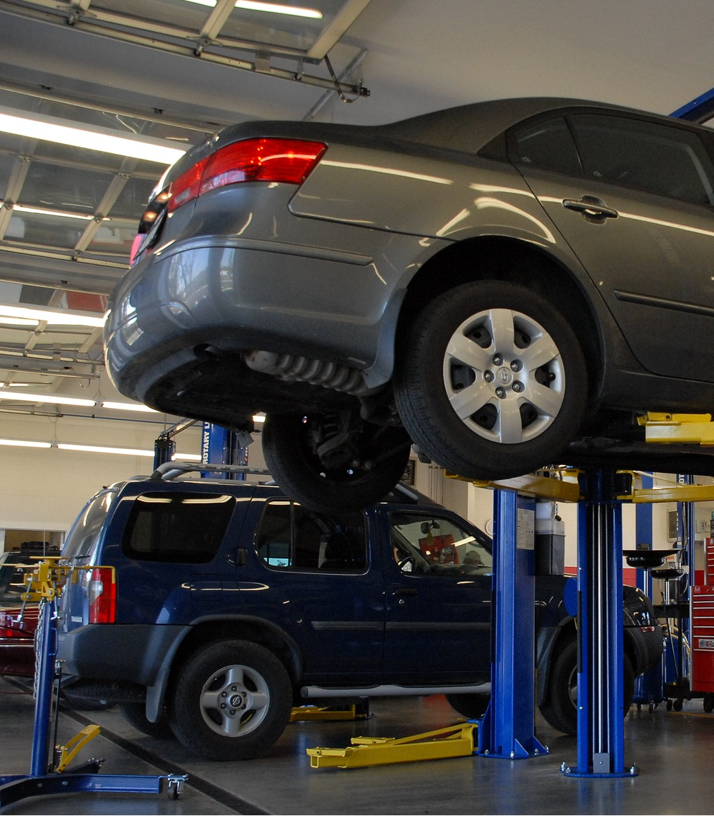 Vehicle repair and maintenance facility shown outfitted in Fume-A-Vent exhaust removal systems.