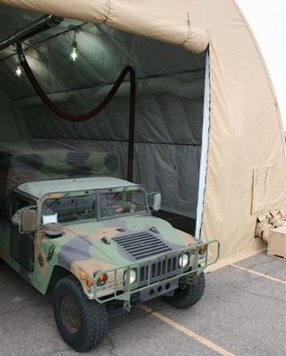 Fume-A-Vent diesel exhaust removal system shown installed and attached to a military humvee to exhaust dangerous exhaust and emissions.